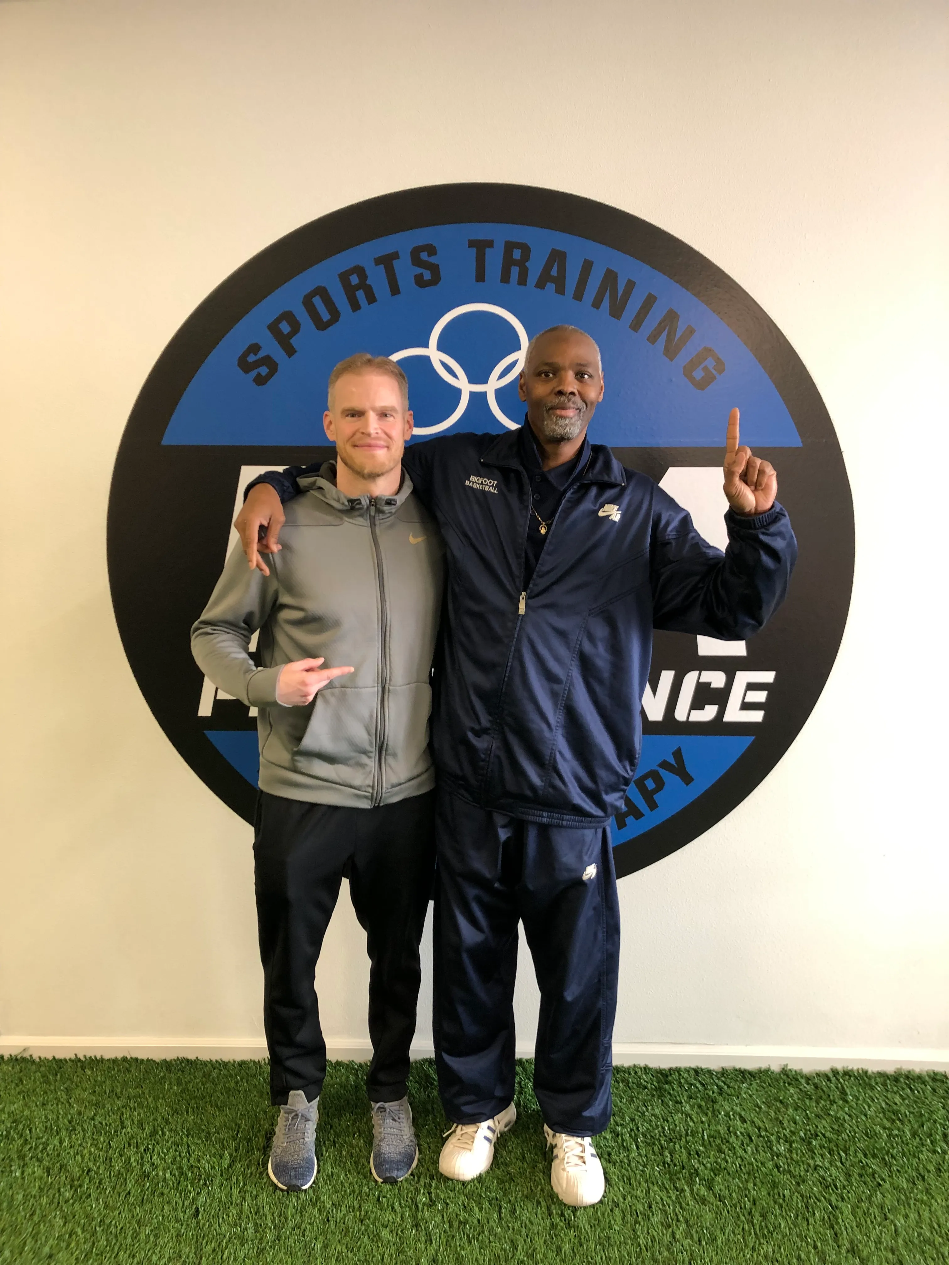 Eric poses with another coach